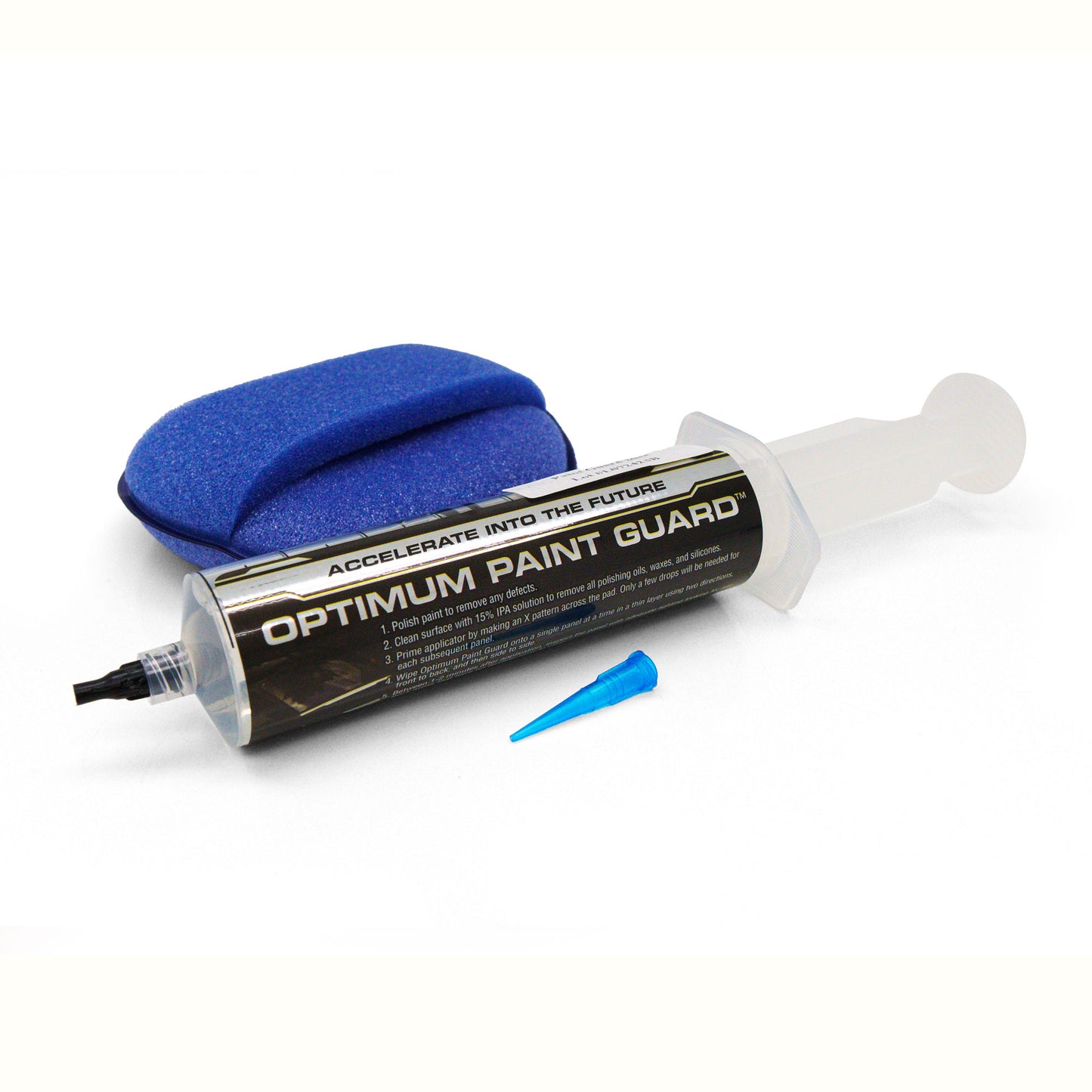Product photograph of an Optimum Paint Guard car detailing kit featuring a textured blue foam applicator pad, a syringe-style bottle with "Accelerate Into The Future" slogan, and a small blue conical tip
