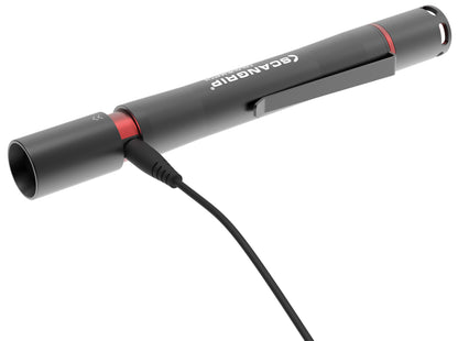 Product image of a black SCANGRIP Colour Match pen light flashlight featuring a prominent white logo, a distinct red accent band, and a black charging cable plugged into its end against a pristine white background