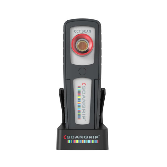 A grey and white ScanGrip CCT SCAN portable work light standing upright with a red ring around its central lens and the brand's colorful striped logo