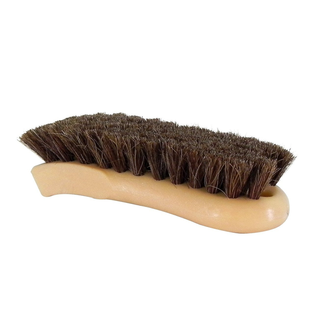 A shoe brush with a light tan ergonomic curved plastic handle and dense dark brown natural bristles