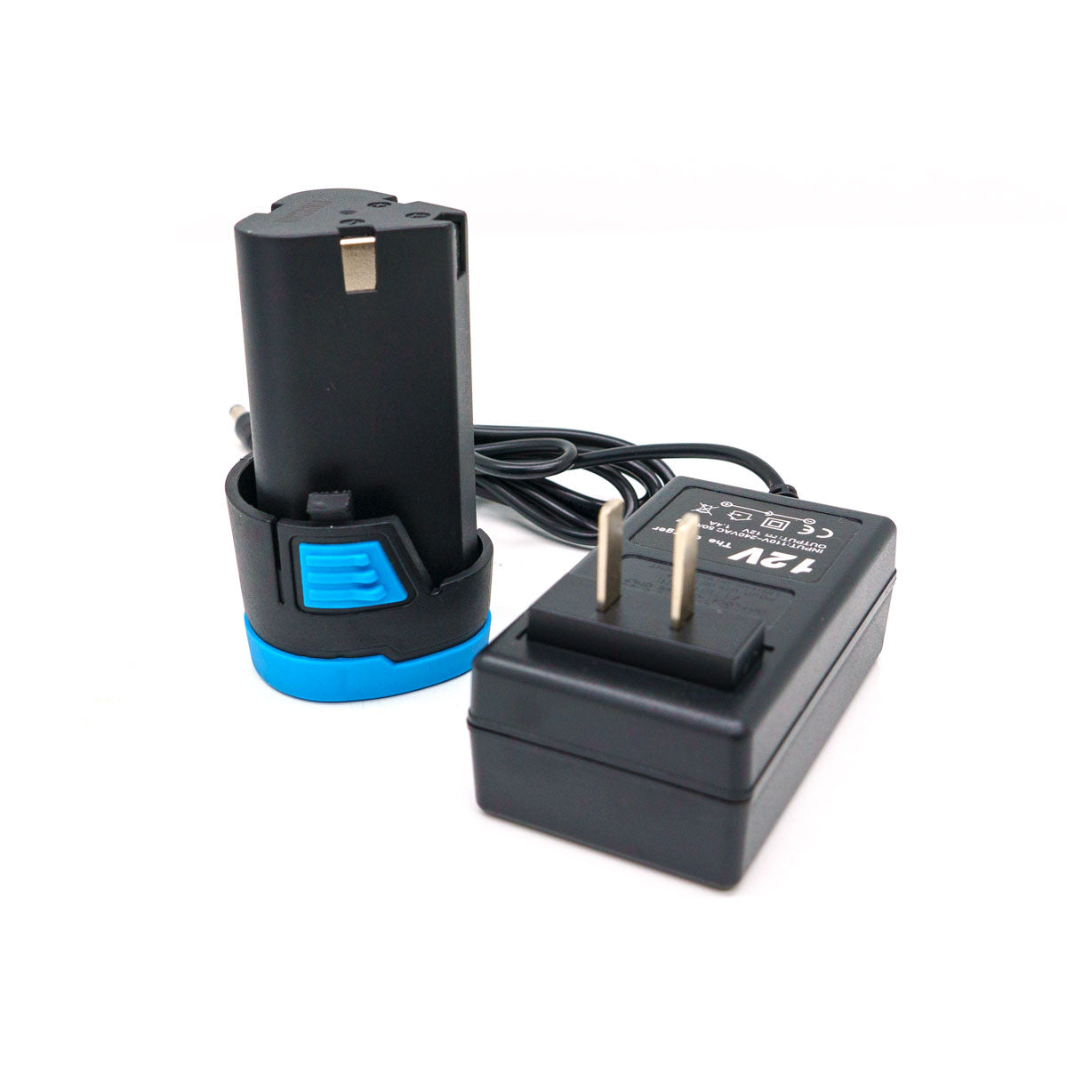 Black rechargeable 12V power tool battery with a bright blue base and release button seated in its black charging cradle next to a black power adapter marked 12V output with a US two-prong plug on a white studio background