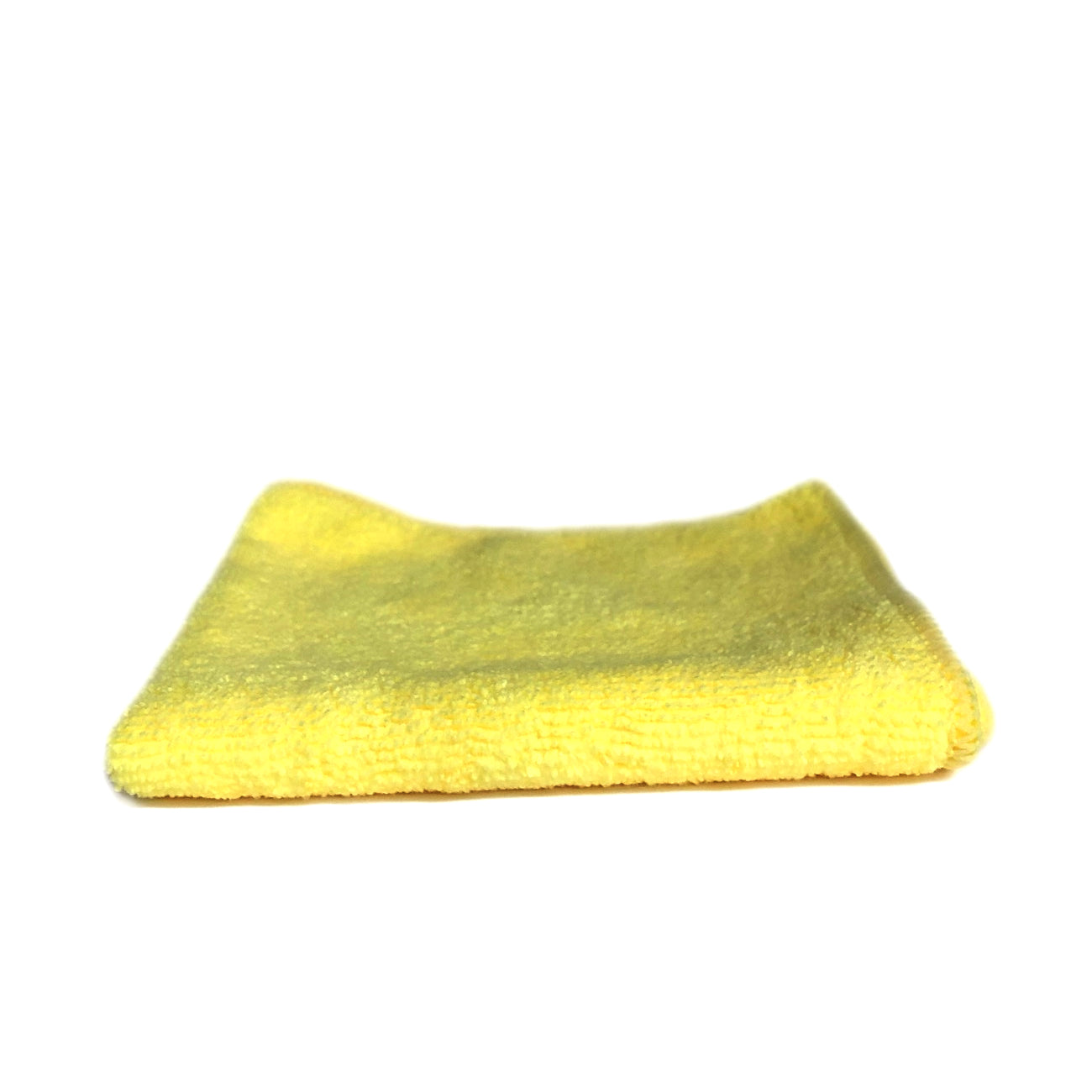 A bright yellow folded microfiber cleaning cloth displaying its soft textured surface on a white background