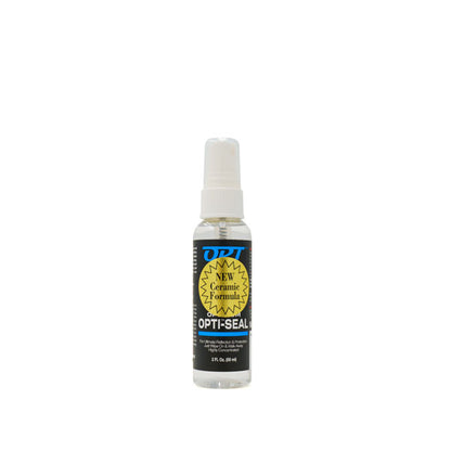 Product image of a 2 FL Oz clear spray bottle of OPT OPTI-SEAL NEW Ceramic Formula, featuring a black label with blue text and a prominent yellow jagged burst on a white background