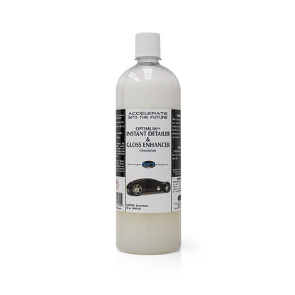 Product photography of an Optimum Polymer Technologies Inc 32 oz clear plastic bottle of Instant Detailer & Gloss Enhancer Concentrate containing milky white liquid, with a white cap and a black label featuring a sleek black sports car graphic