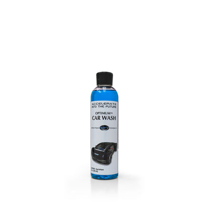 Clear plastic bottle of Optimum Car Wash containing bright blue liquid with a black cap, featuring a white label displaying ACCELERATE INTO THE FUTURE and a stylized black car graphic