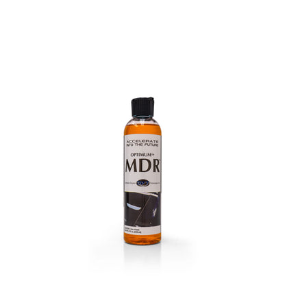 Product photo of an Optimum MDR bottle on a white background, featuring a clear bottle filled with bright orange liquid, a black flip-top cap, and a white label prominently displaying OPTIMUM™ MDR™ and the slogan ACCELERATE INTO THE FUTURE