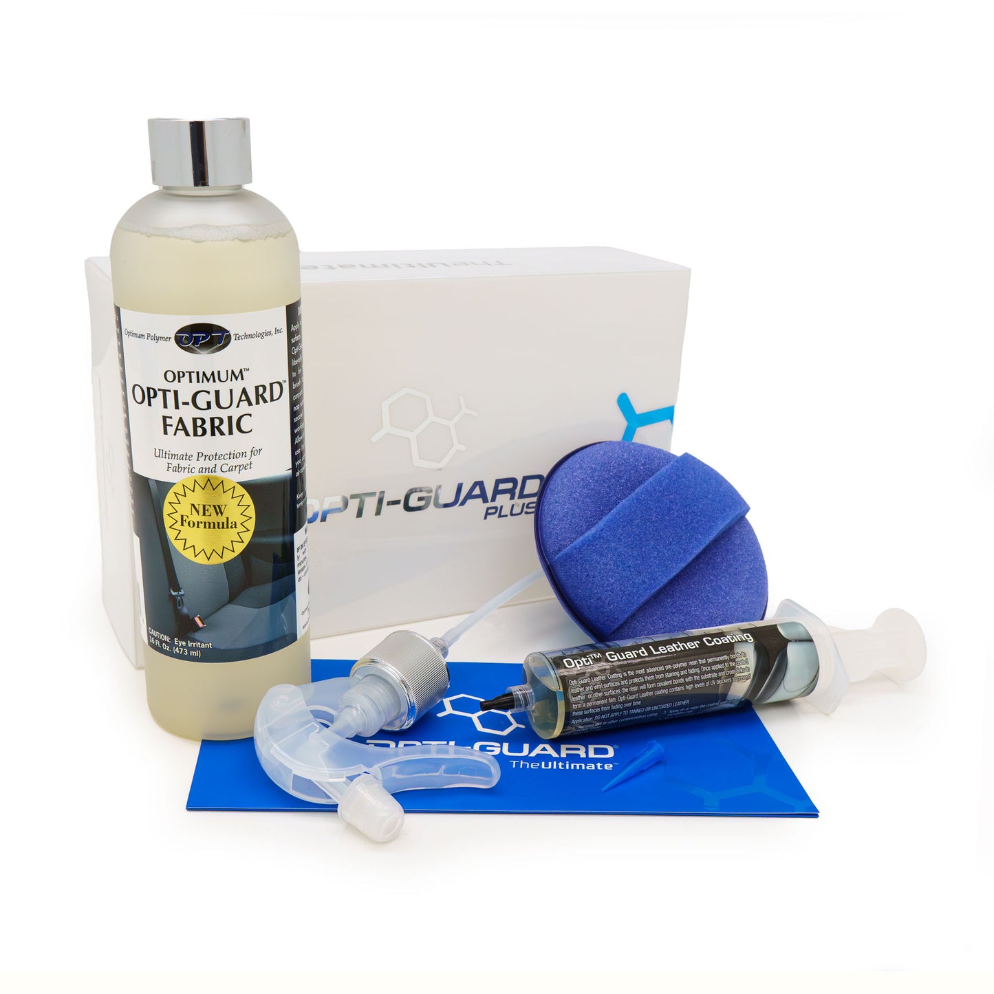 Product photography showcasing the Optimum Opti-Guard Plus fabric and leather protection kit on a white background, featuring a bottle of Opti-Guard Fabric with a yellow "NEW FORMULA" label, a syringe of Opti-Guard Leather Coating, and a blue applicator sponge with a blue instruction sheet