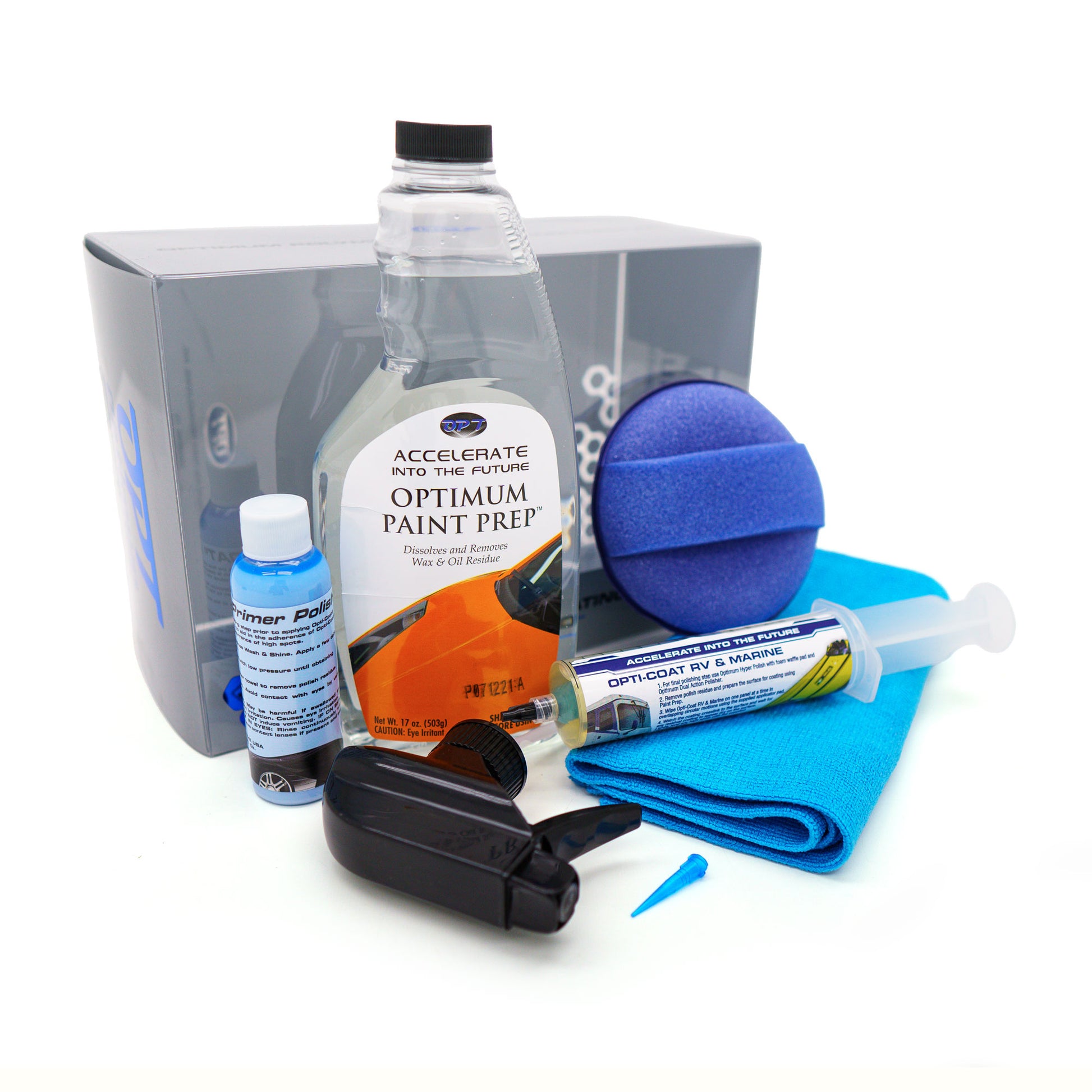 A car detailing kit featuring an Optimum Paint Prep bottle with an orange car graphic, a blue Primer Polish bottle, an Opti-Coat RV & Marine syringe, a round blue applicator sponge, and a folded blue microfiber towel on a white background