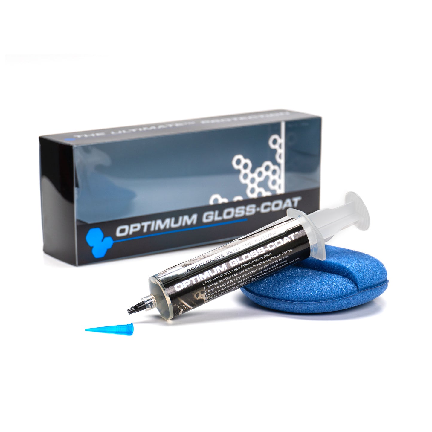 Optimum Gloss-Coat car detailing kit featuring a clear syringe applicator, a dark blue product box with molecular graphics, a vibrant blue foam pad, and a small blue cap on a crisp white studio background