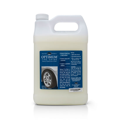 Product photography of a white 1-gallon jug of Optimum Tire Shine featuring a large blue label detailing its benefits, including ozone and UV protectants, and a graphic of a shiny car tire with a silver rim