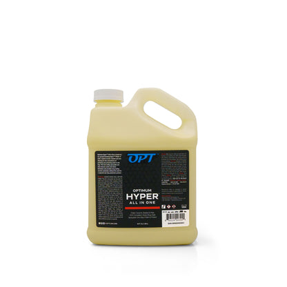 Product photography of a light yellow gallon jug of OPT Optimum Hyper All In One car polish ceramic sealant and wax with a white cap and a black and white label displaying product details, a barcode, and a Made in USA logo