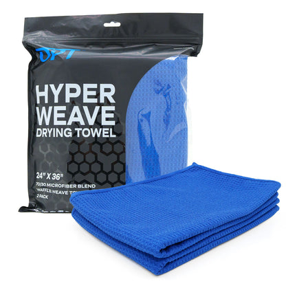 OPT Hyper Weave Drying Towel on a white studio background showing one folded vibrant royal blue waffle weave microfiber towel next to its black packaging displaying "HYPER WEAVE DRYING TOWEL" text and "24 X 36" 2 PACK"