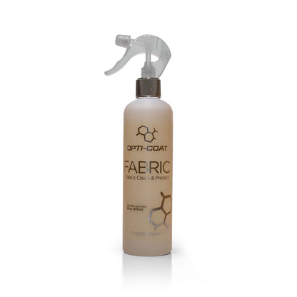 Opti-Coat product photography of a translucent white Opti-Coat Fabric Clean & Protect spray bottle featuring a clear trigger sprayer, metallic silver neck, and subtle gray hexagonal molecular graphics on a clean white studio background