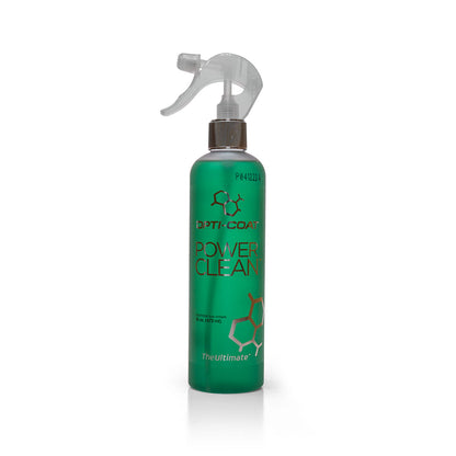 A vibrant green OPTI-COAT POWER CLEAN spray bottle with a clear nozzle and copper hexagonal graphics stands on a plain white background