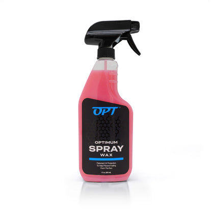 A bright pink Optimum Spray Wax car detailing bottle with a black trigger sprayer on a white background displaying a black label featuring a blue OPT logo hexagonal pattern and Patented UV Protection text