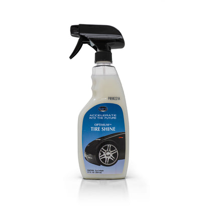 Optimum brand product photo of a translucent spray bottle of Tire Shine, featuring a black trigger top and a blue label with a black car's tire and "ACCELERATE INTO THE FUTURE" text, filled with milky white liquid on a white studio background