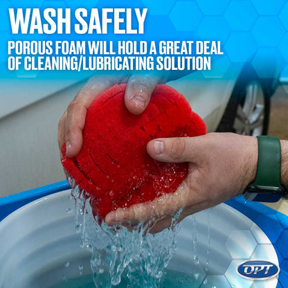 Digital photograph showing a person's hand with a green smartwatch squeezing a red porous foam sponge, releasing streams of water into a blue bucket with a white car visible in the background, all framed by promotional text WASH SAFELY and an OPT logo
