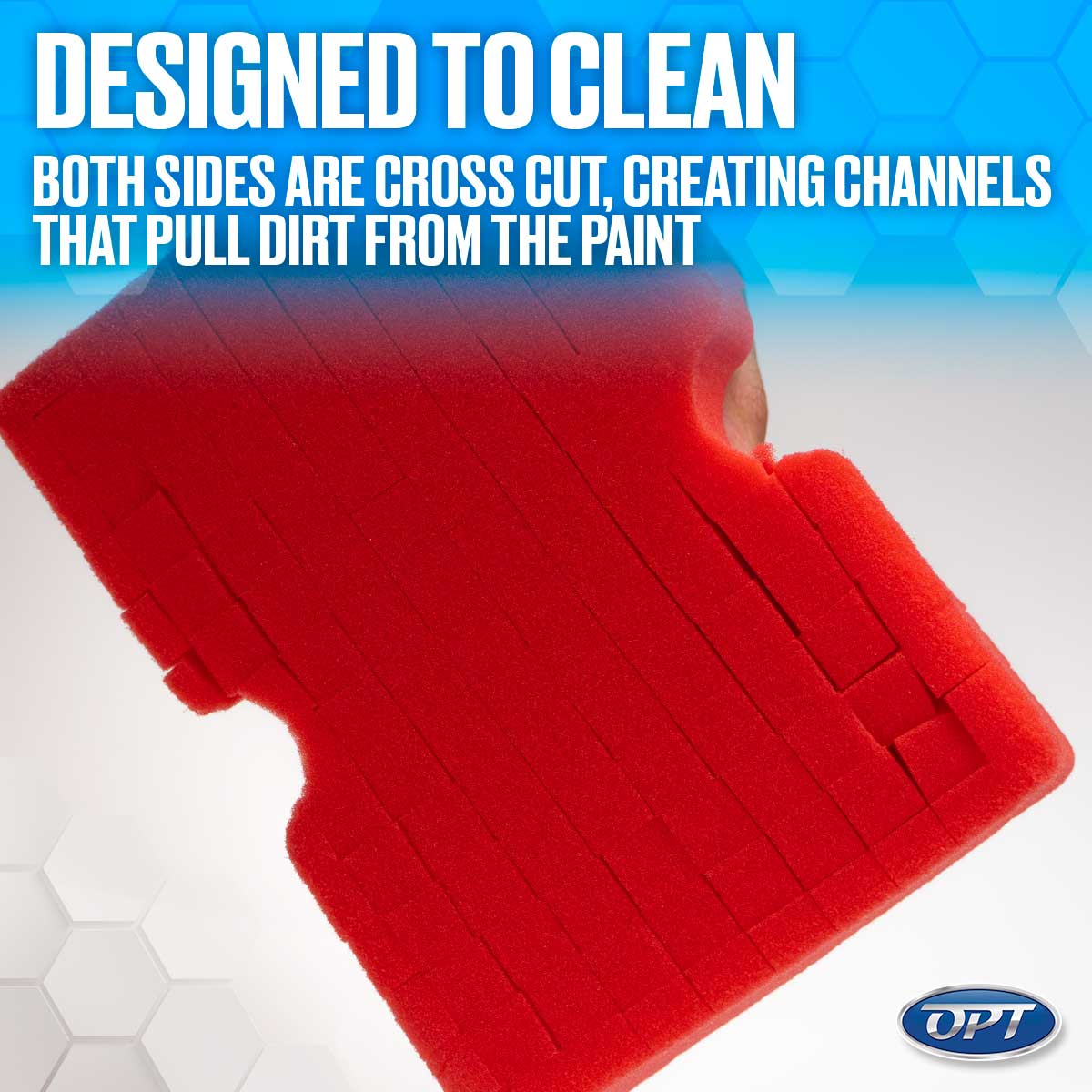 Product photograph by OPT showcasing a vibrant red cross-cut foam cleaning pad held by a hand against a blue and white hexagonal background, featuring descriptive text 'DESIGNED TO CLEAN BOTH SIDES ARE CROSS CUT, CREATING CHANNELS THAT PULL DIRT FROM THE PAINT'