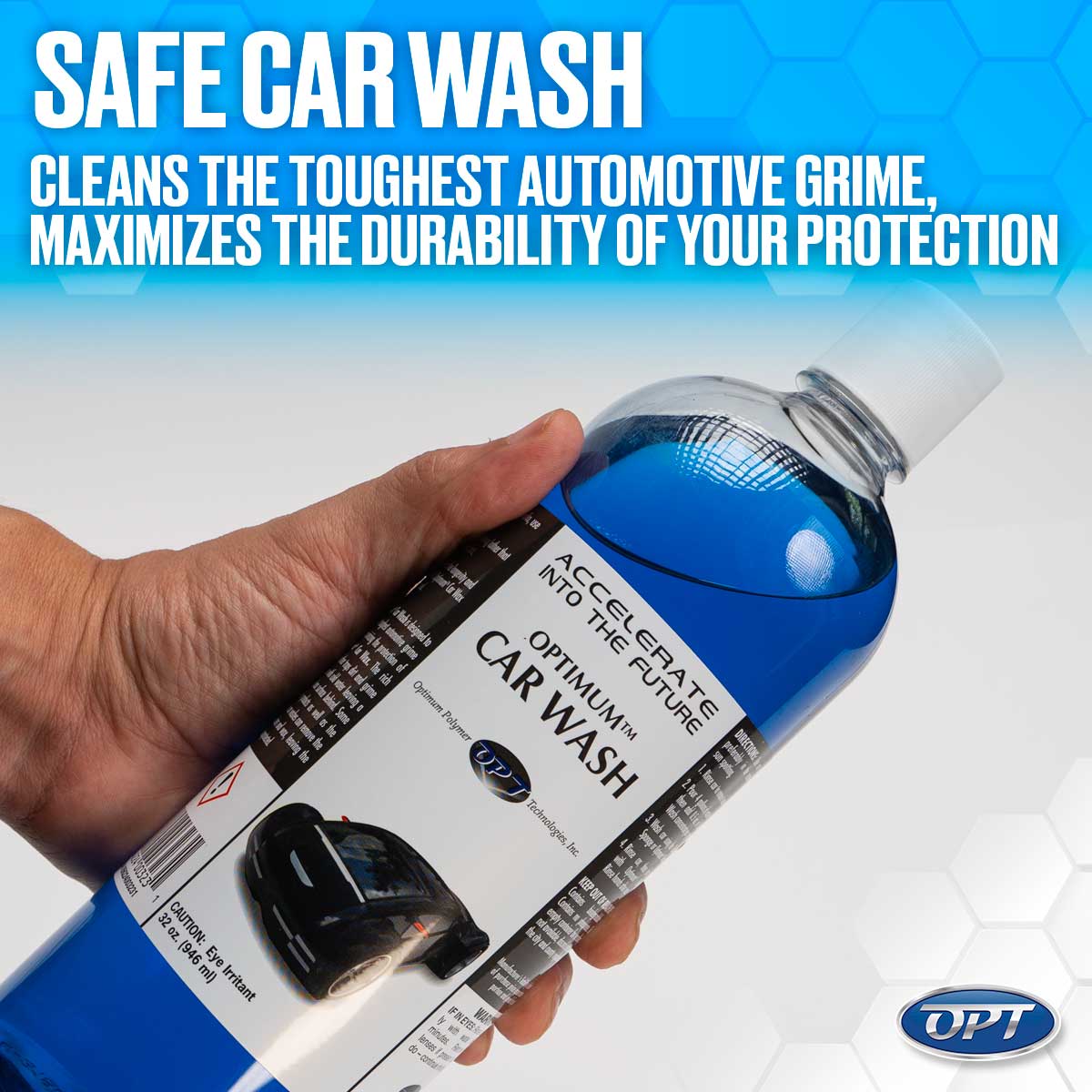 Product photography of a hand holding a clear bottle of Optimum Car Wash with vibrant blue liquid, a white label displaying "ACCELERATE INTO THE FUTURE" and a graphic of a black car, set against a blue hexagonal background with "SAFE CAR WASH" promotional text
