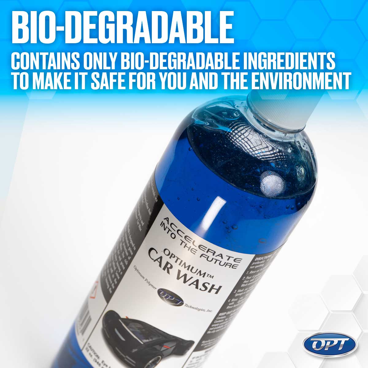 Photograph of an Optimum Car Wash bottle with bright blue liquid, a label featuring a black sports car graphic, and the prominent text BIO-DEGRADABLE against a blue hexagonal background