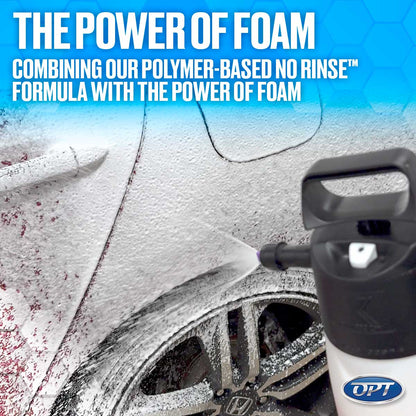 Photograph showing a black and white manual foam sprayer with an OPT logo coating a dark red car and its silver Honda alloy wheel in dense white foam, with prominent text "THE POWER OF FOAM" overhead