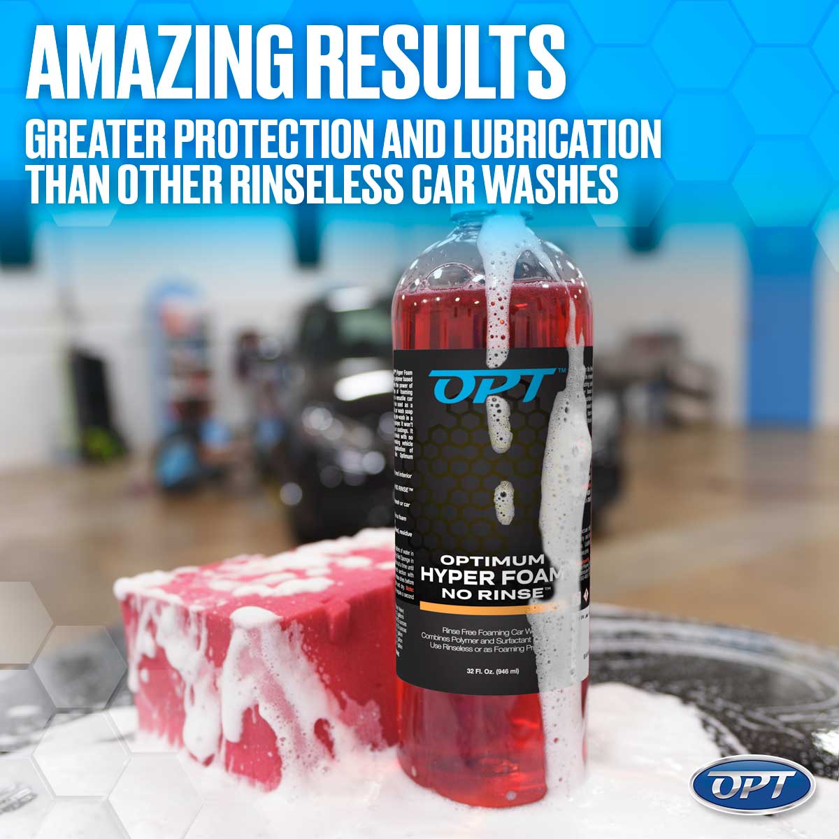 Digital photography by OPT showcasing a clear bottle of red Optimum Hyper Foam No Rinse car wash product overflowing with white foam onto a red car wash sponge in a car wash setting, featuring "AMAZING RESULTS" text on a blue hexagonal background