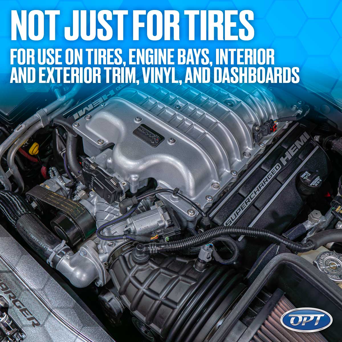 Close-up of a powerful SUPERCHARGED HEMI engine bay showcasing its sleek silver supercharger, intricate belts, and black ribbed air intake system