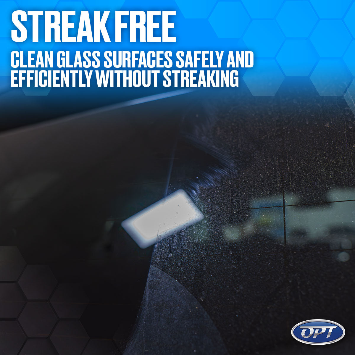 Digital image of a car windshield exhibiting a contrast between a dirty, speckled surface and a clean area with a bright rectangular light reflection, overlaid with "STREAK FREE Clean glass surfaces safely and efficiently without streaking" text, an OPT logo, and a blue hexagonal background