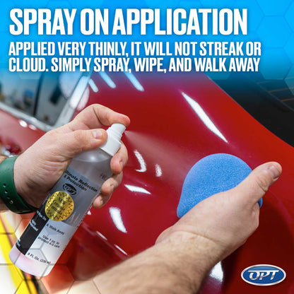 A hand sprays Ultimate Reflection & Protection ceramic formula from a clear bottle onto a glossy red car surface next to a vibrant blue applicator pad with overlay text reading "SPRAY ON APPLICATION" and an OPT logo
