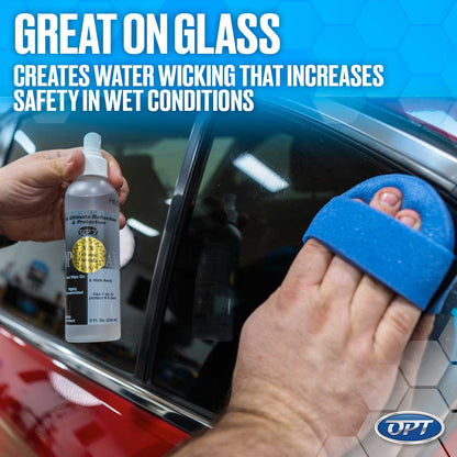 Commercial photograph of a person's hands applying OPT Ultimate Reflection & Protection ceramic formula from a clear bottle featuring a yellow New Ceramic Formula sticker with a vibrant blue applicator sponge to a shiny red car's side window with the prominent graphic overlay Great On Glass