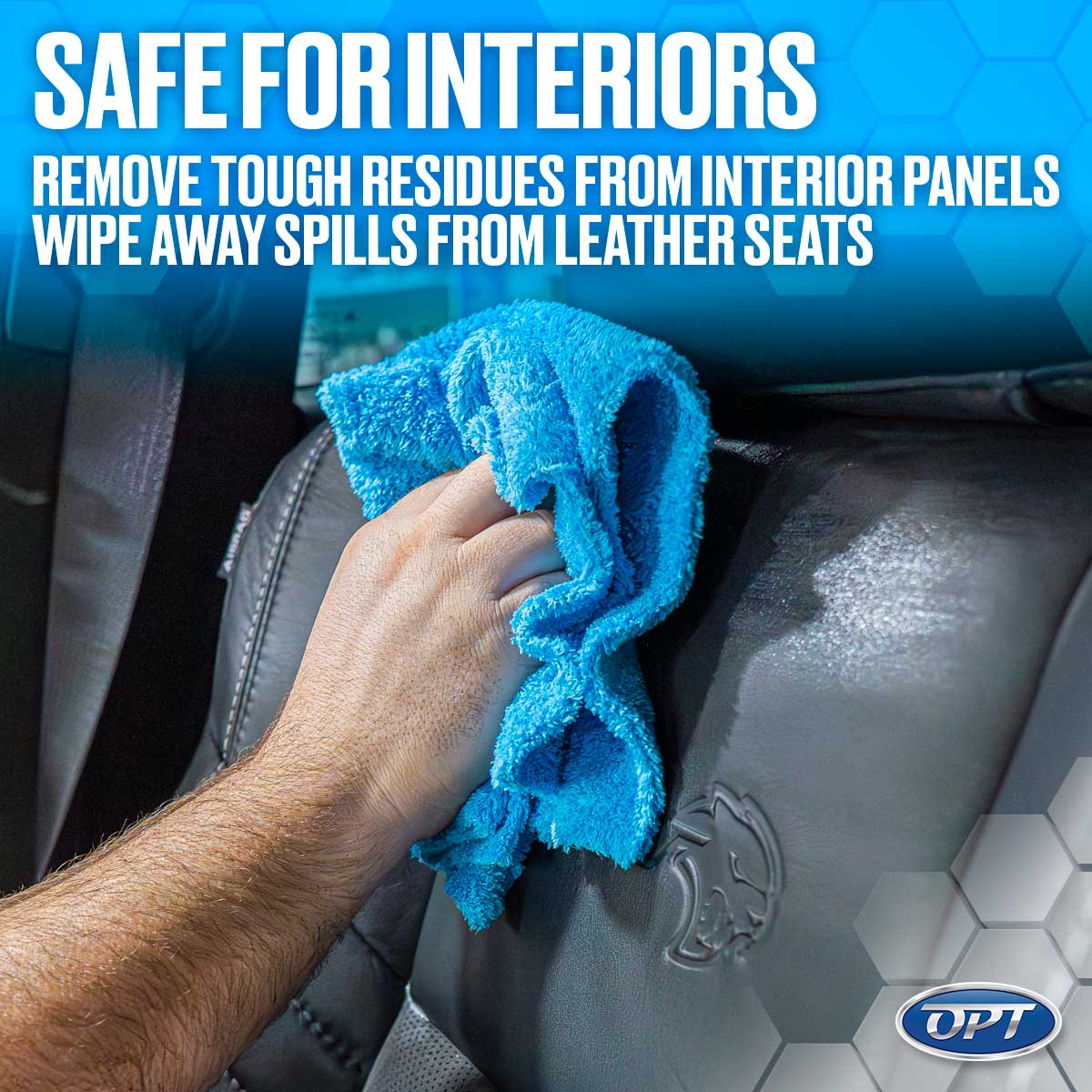 A person's hand uses a bright blue microfiber cloth to clean a black leather car seat featuring an embossed cat head logo, demonstrating automotive interior care