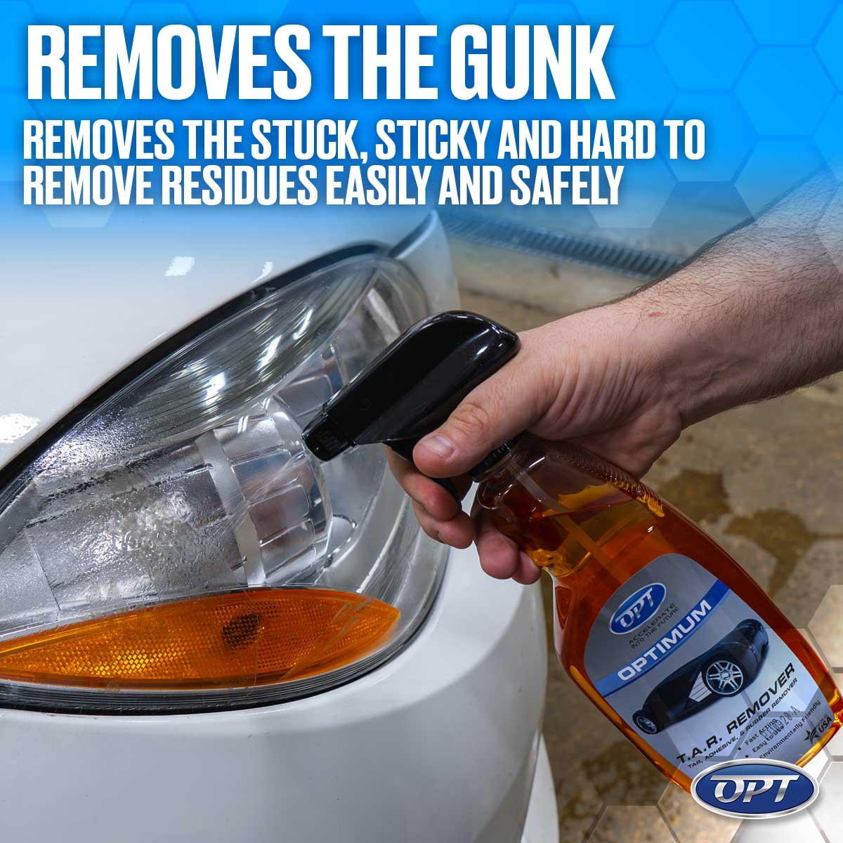 Digital photograph of a hand spraying orange Optimum T.A.R. Remover from a black bottle onto a dirty white car headlight with an amber turn signal, with a blue banner stating "Removes the Gunk"