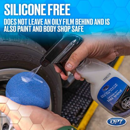 Digital photograph of a hand spraying Optimum Tire Shine from a bottle onto a blue applicator sponge next to a car tire in a garage, featuring the 'SILICONE FREE' label and a yellow floor safety strip