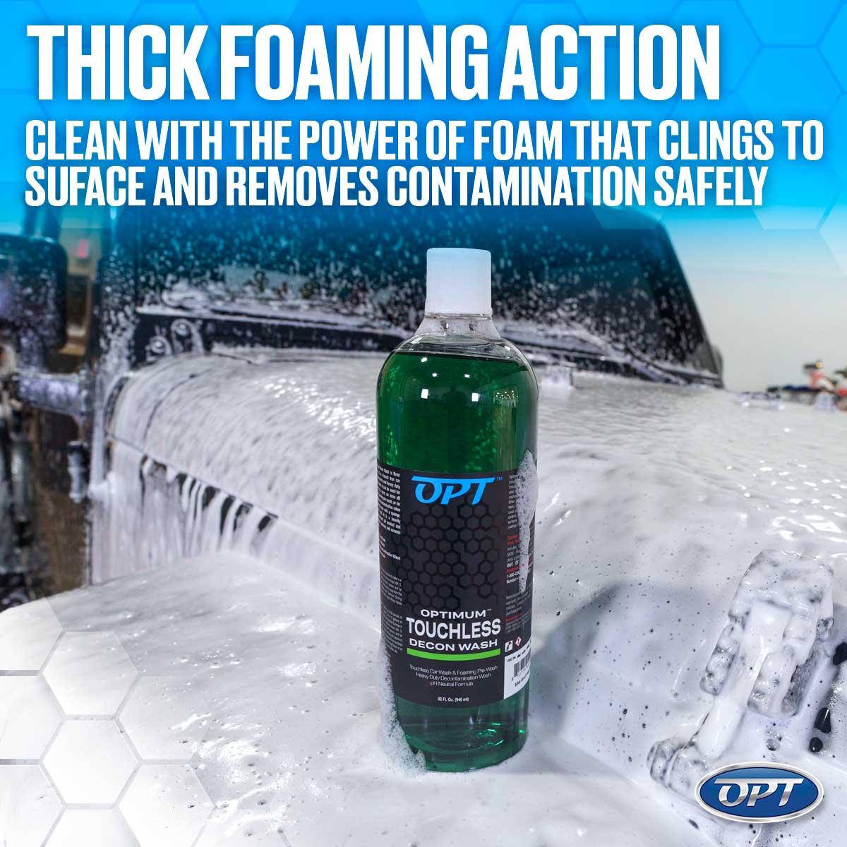 A bottle of bright green OPT Optimum Touchless Decon Wash stands on a dark SUV covered in thick white foam, with a blue gradient background and promotional text THICK FOAMING ACTION