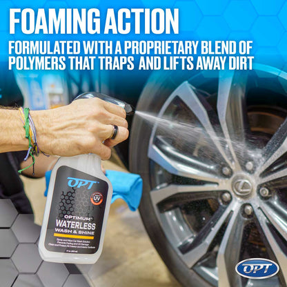 Photograph of a hand spraying OPT Optimum Waterless Wash & Shine from a white bottle onto a shiny Lexus car wheel, featuring colorful bracelets, a black ring, a blue microfiber towel, and a Foaming Action text overlay