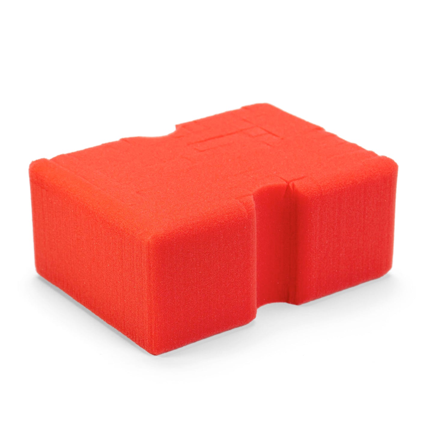 Product photo of a bright red textured foam block with irregular cut-out shapes on a clean white background