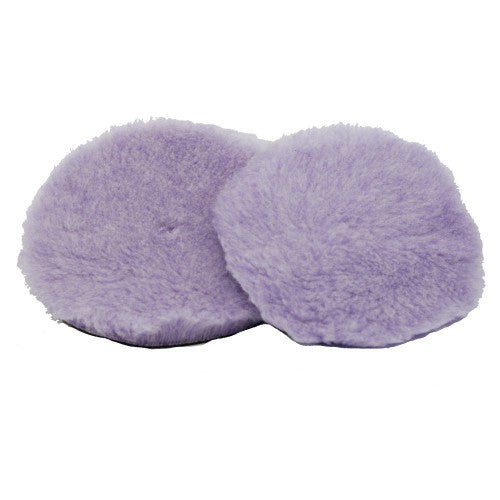Photograph of two fluffy lavender purple circular buffing pads overlapping slightly