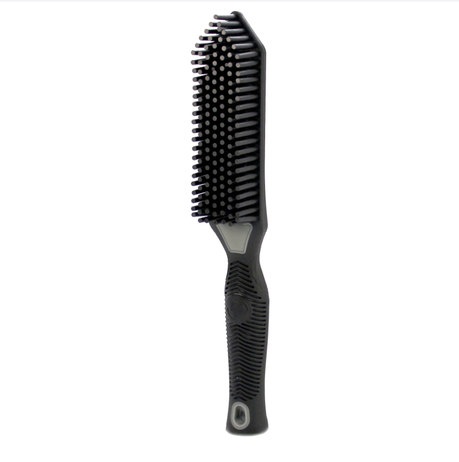 A black rectangular styling brush with dense short bristles and a textured ergonomic handle featuring subtle grey details