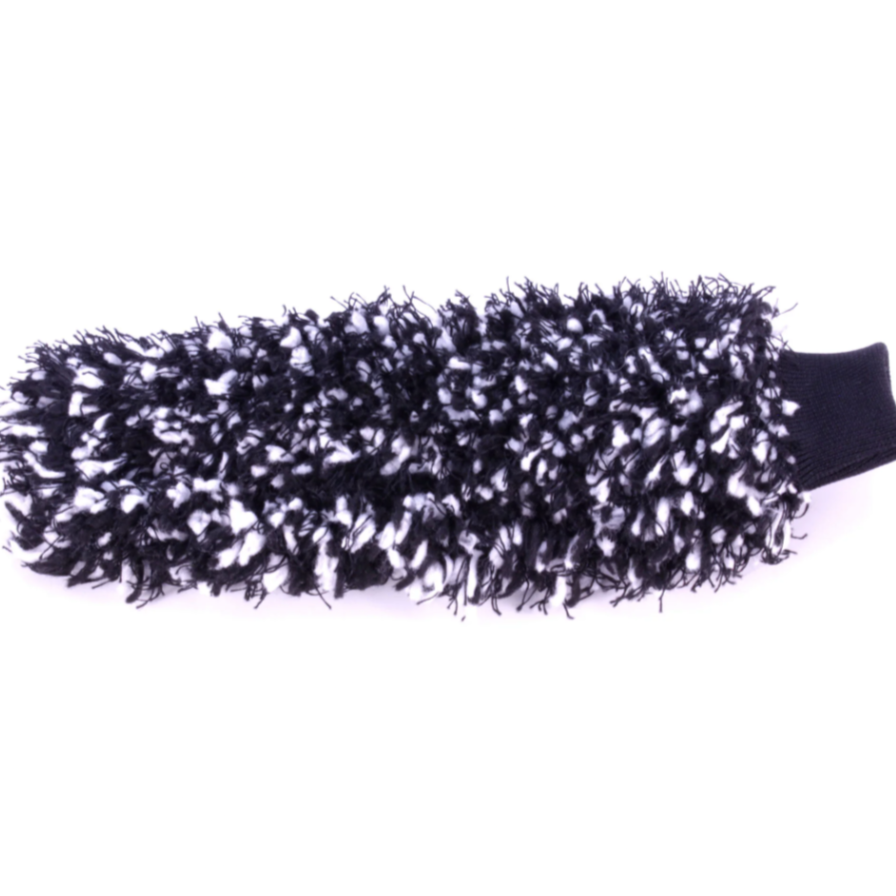 A cleaning mitt with black and white shaggy texture and a solid black ribbed cuff on a plain white background