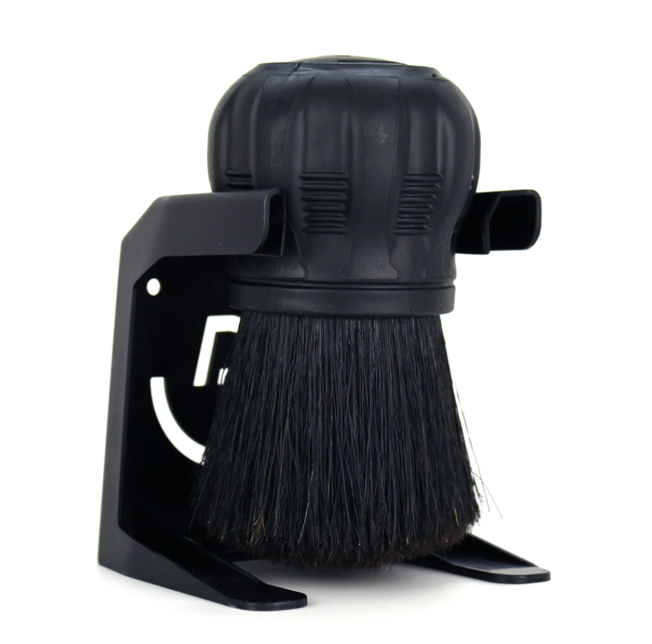 Pallo Coffeetool black cleaning brush in its stand with dense black bristles a textured rubber handle and the distinctive white Pallo logo cutout