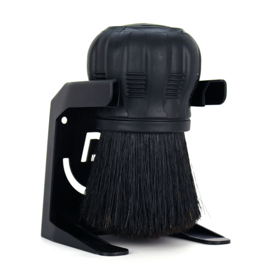 Pallo Coffeetool black cleaning brush in its stand with dense black bristles a textured rubber handle and the distinctive white Pallo logo cutout