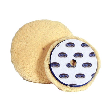 Two car detailing buffing pads, one light yellow wool-like and fluffy, the other with a white backing displaying multiple blue and black OPT logos and a central hole, accented by a thin blue rim