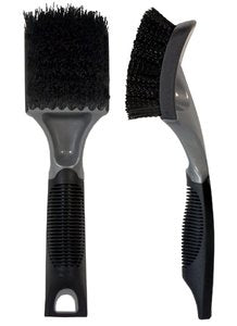 Product photo featuring two automotive detailing brushes, one with a flat rectangular black bristled head and a textured gray handle, the other with a curved black bristled head and a sleek gray and black ergonomic handle displayed against a plain white background